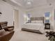 Luxurious main bedroom boasts soft lighting and a tray ceiling feature at 6894 E 133Rd Pl, Thornton, CO 80602
