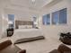 An elegant main bedroom features bright lighting and a spacious layout at 6894 E 133Rd Pl, Thornton, CO 80602