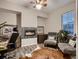 Cozy office space featuring modern fireplace and comfortable seating at 6894 E 133Rd Pl, Thornton, CO 80602