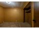 Bedroom featuring wood paneling, carpeting, and built-in closet organizers at 2115 W 90Th Ave, Federal Heights, CO 80260