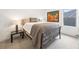 Cozy bedroom with stylish decor and a comfortable bed and plenty of natural light at 3928 N Vrain St, Denver, CO 80212