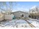This backyard features a patio area and partially fenced yard at 1125 Newark St, Aurora, CO 80010