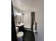 Chic bathroom featuring modern black fixtures, bathtub, and sleek tile work at 1125 Newark St, Aurora, CO 80010