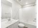 Bright bathroom featuring a white vanity, modern faucet, and a shower-tub combination at 259 E 4Th St, Berthoud, CO 80513
