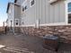 Exterior of home featuring gray siding with a stone foundation and central air unit at 259 E 4Th St, Berthoud, CO 80513