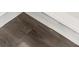 Detailed close-up of modern, light-toned laminate flooring at 259 E 4Th St, Berthoud, CO 80513
