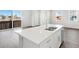 Spacious kitchen island with stainless steel dishwasher and dual sink, perfect for culinary enthusiasts at 259 E 4Th St, Berthoud, CO 80513