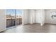 Bright living room with sliding glass door and neutral walls, creating an open atmosphere at 259 E 4Th St, Berthoud, CO 80513
