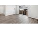 Spacious living room features hardwood floors and sliding glass doors to the outside, creating an open atmosphere at 259 E 4Th St, Berthoud, CO 80513