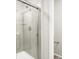 Modern tiled shower with glass door and chrome fixtures at 259 E 4Th St, Berthoud, CO 80513