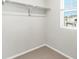 Walk-in closet with closet rod and window for natural light at 259 E 4Th St, Berthoud, CO 80513
