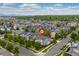 Stunning aerial view of a residential neighborhood with tree-lined streets and mountain views at 1813 W 67Th Ave, Denver, CO 80221