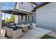 Relaxing backyard patio featuring a firepit, outdoor seating, and lovely string lights at 1813 W 67Th Ave, Denver, CO 80221