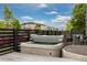 Backyard featuring a hot tub with a dark wood privacy fence at 1813 W 67Th Ave, Denver, CO 80221