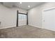 Finished basement featuring neutral walls, carpet, and a window at 1813 W 67Th Ave, Denver, CO 80221