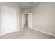 Neutrally decorated bedroom featuring an open doorway and carpeted floors at 1813 W 67Th Ave, Denver, CO 80221