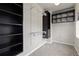 Walk-in closet is equipped with shelving, hanging rods, and storage units for optimal organization at 1813 W 67Th Ave, Denver, CO 80221