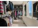 Walk-in closet with built-in shelving and ample storage for clothes and accessories at 1813 W 67Th Ave, Denver, CO 80221