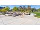 Community park features a stepped rock area with grass and a concrete base at 1813 W 67Th Ave, Denver, CO 80221