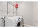 Modern laundry room with Samsung washer and dryer and wire shelving at 1813 W 67Th Ave, Denver, CO 80221