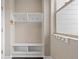 Cozy mudroom with storage, shelving, and hooks, conveniently located by a window at 1813 W 67Th Ave, Denver, CO 80221