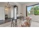 Inviting home office featuring large windows, modern decor, and a comfortable chair at 1813 W 67Th Ave, Denver, CO 80221