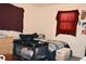 Cozy bedroom with crib, dresser, and window covered by a red cloth at 2885 Quay St, Wheat Ridge, CO 80033