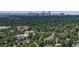 Overhead view showcasing the tree-filled neighborhood and city skyline beyond at 2405 S Franklin, Denver, CO 80210