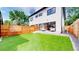 Spacious backyard featuring a lawn, patio area, and fence for added privacy at 2405 S Franklin, Denver, CO 80210