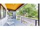 Relaxing balcony with seating overlooking the neighborhood street at 2405 S Franklin, Denver, CO 80210