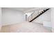 Spacious basement with plush carpet, recessed lighting and modern staircase with iron railing at 2405 S Franklin, Denver, CO 80210