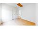 This clean and bright bedroom offers wood floors, white walls, and natural light at 2405 S Franklin, Denver, CO 80210