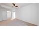 Spacious bedroom features neutral carpet, closet with sliding doors, and recessed lighting for a minimalist design at 2405 S Franklin, Denver, CO 80210