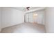 A well-lit bedroom featuring neutral carpet, closet space and a modern ceiling fan at 2405 S Franklin, Denver, CO 80210