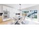 Modern dining room featuring stylish table, chairs, and abundant natural light at 2405 S Franklin, Denver, CO 80210