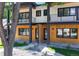 Stylish two-story duplex showcasing modern architecture and manicured landscaping at 2405 S Franklin, Denver, CO 80210