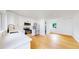 Modern kitchen features stainless steel appliances, white cabinets, and hardwood floors, creating a clean aesthetic at 2405 S Franklin, Denver, CO 80210
