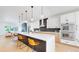 Bright kitchen featuring an island with bar stool seating and stainless steel appliances at 2405 S Franklin, Denver, CO 80210