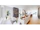 Bright living room featuring a modern fireplace, recessed lighting, and a view into the open concept kitchen at 2405 S Franklin, Denver, CO 80210