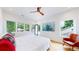 Bright main bedroom with large windows, hardwood floors, and an accent chair at 2405 S Franklin, Denver, CO 80210