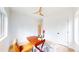 This home office features hardwood floors, soft rug, natural light, and modern ceiling fan at 2405 S Franklin, Denver, CO 80210