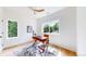 Bright, airy office with hardwood floors, modern ceiling fan and outdoor view at 2405 S Franklin, Denver, CO 80210