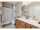 Clean bathroom with a shower/tub combo and vanity at 10810 W 63Rd Ave # C, Arvada, CO 80004