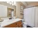 Clean bathroom with shower/tub combo and wood vanity at 10810 W 63Rd Ave # C, Arvada, CO 80004