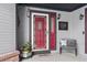 Inviting front entrance with red door and welcoming decor at 10810 W 63Rd Ave # C, Arvada, CO 80004