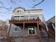 Two story home with deck, stairs, and a partially visible yard at 17 Ellendale St, Castle Rock, CO 80104