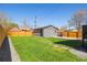 Well-kept backyard with a detached garage, perfect for outdoor activities at 15 Hazel Ct, Denver, CO 80219
