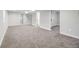 Spacious basement with neutral carpet and walls, offering a blank canvas for versatile living or recreational space at 15 Hazel Ct, Denver, CO 80219