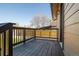 Cozy wooden deck with dark-stained railings, perfect for outdoor relaxation at 15 Hazel Ct, Denver, CO 80219