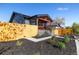 Landscaped exterior featuring a fence, green plants, and pathway at 15 Hazel Ct, Denver, CO 80219